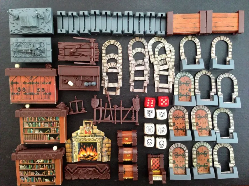 Open and closed doors, dungeon furniture such as a fireplace, bookcases and chests, and the combat dice showing skulls and shields.